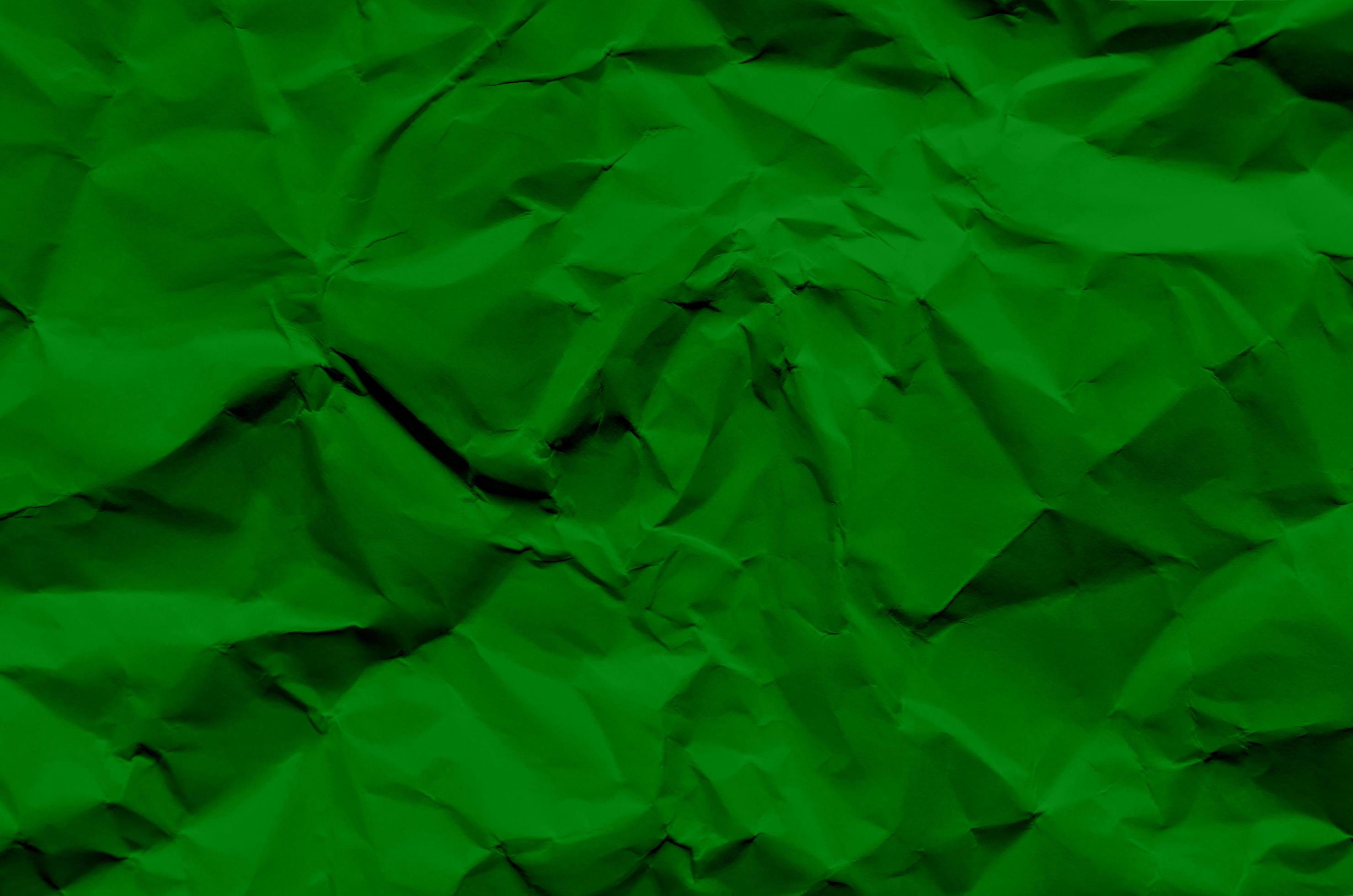 Green background and wallpaper by crumpled paper texture. 3335900 Stock