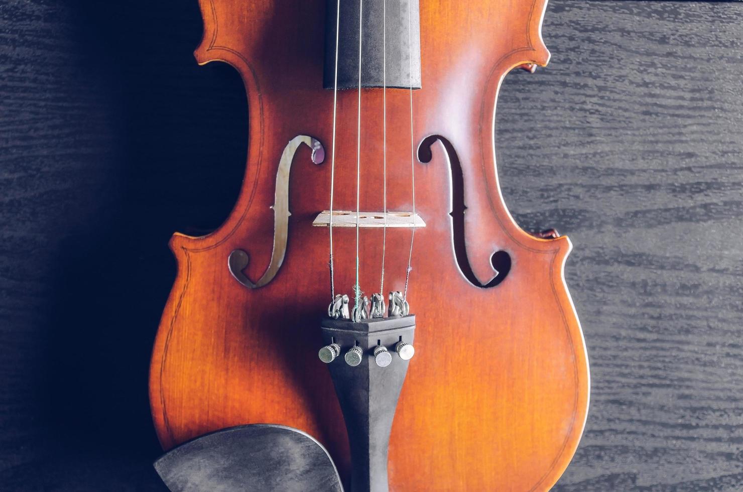 The violin on table, Classic musical instrument used in the orchestra. photo