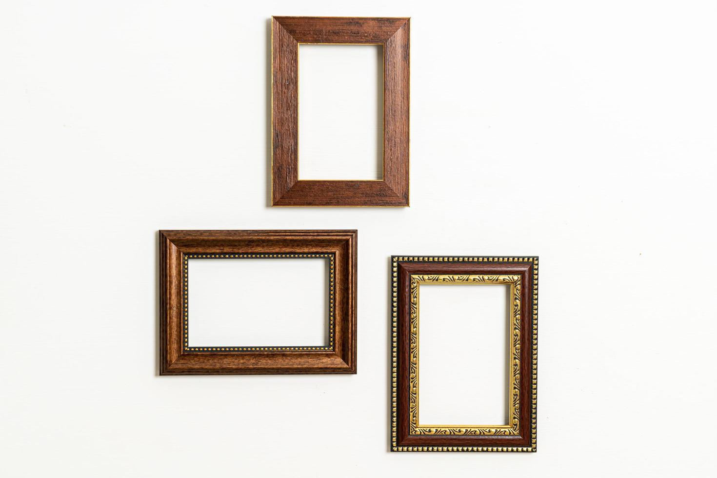 Empty picture frame on white wall background photo