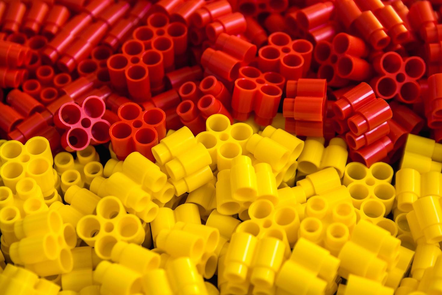 Plastic bricks of yellow and red on a background photo