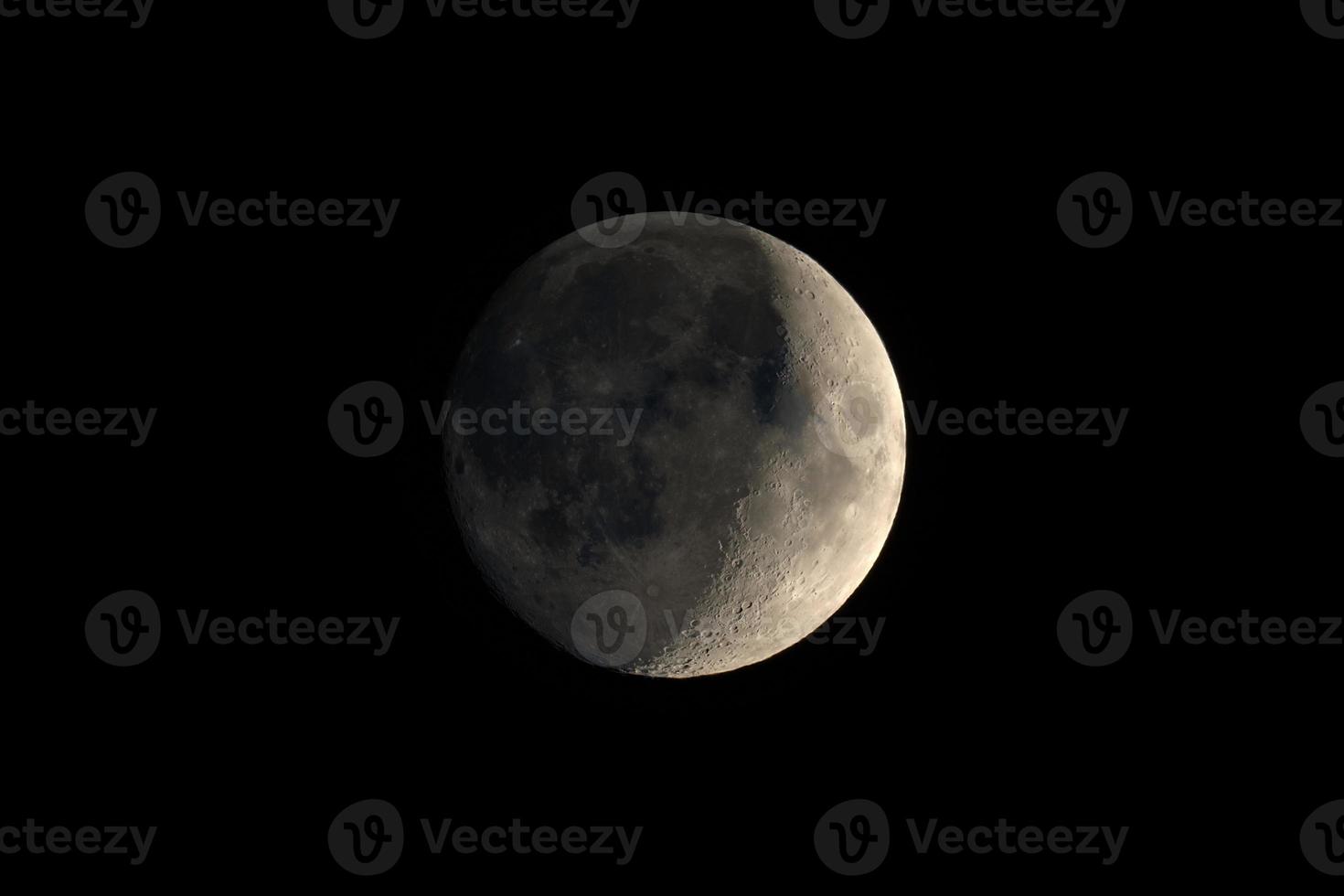 Waxing crescent moon seen with telescope photo