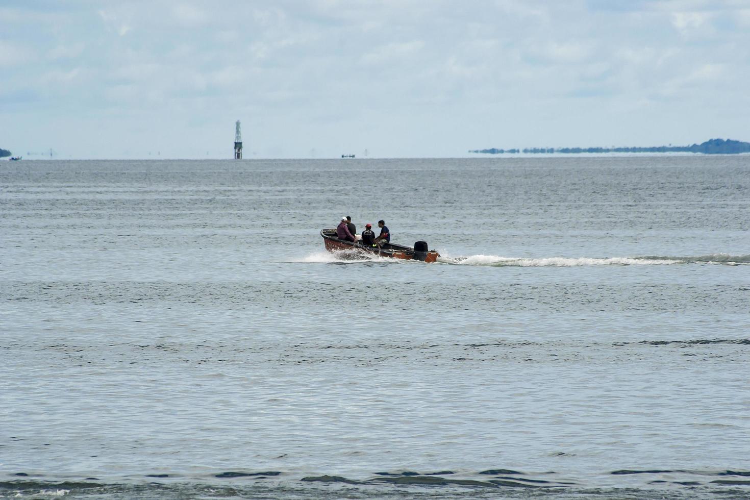 Sorong, Indonesia 2021- A boat crossing the sea photo