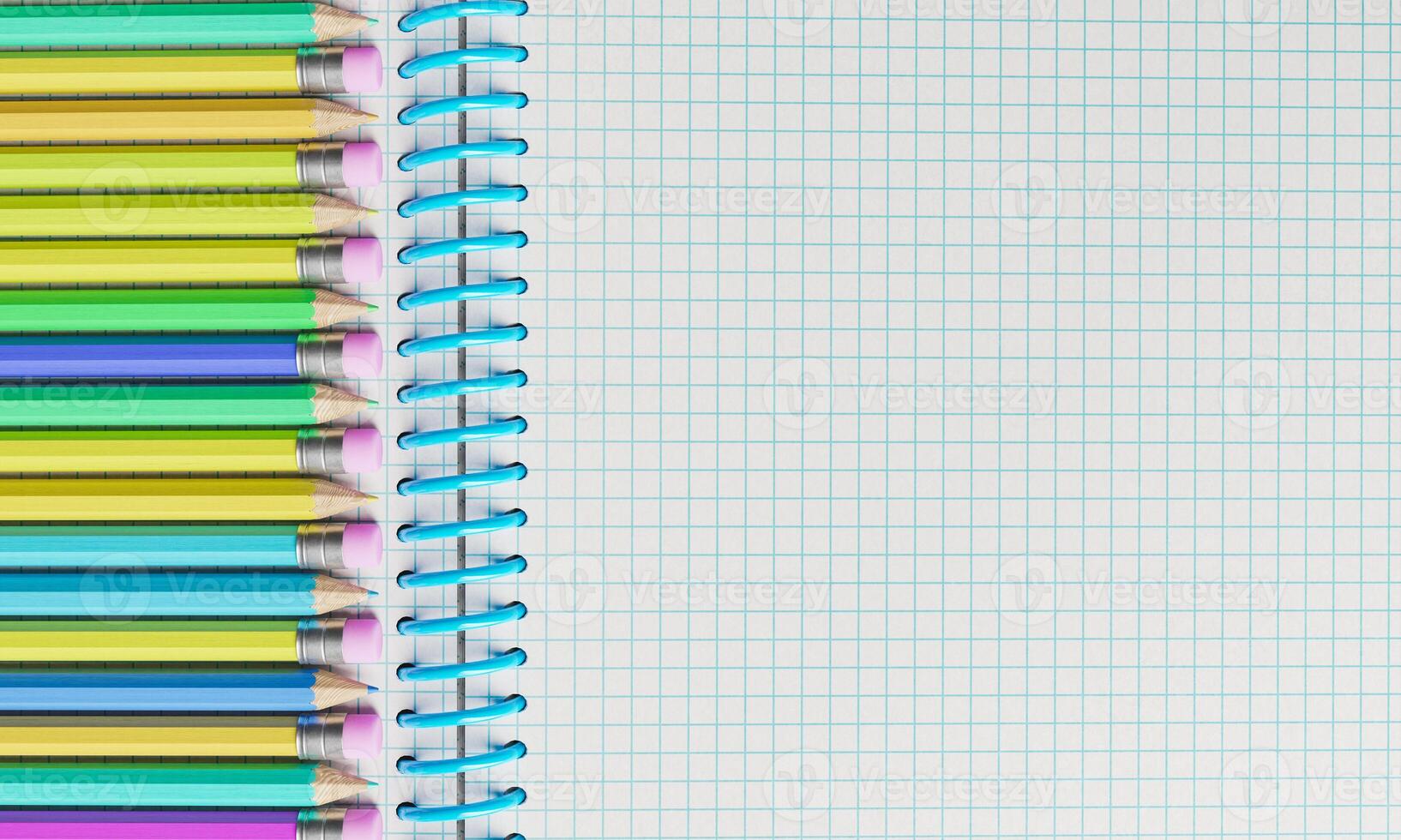 Top view of notebook with multicolored pencils photo