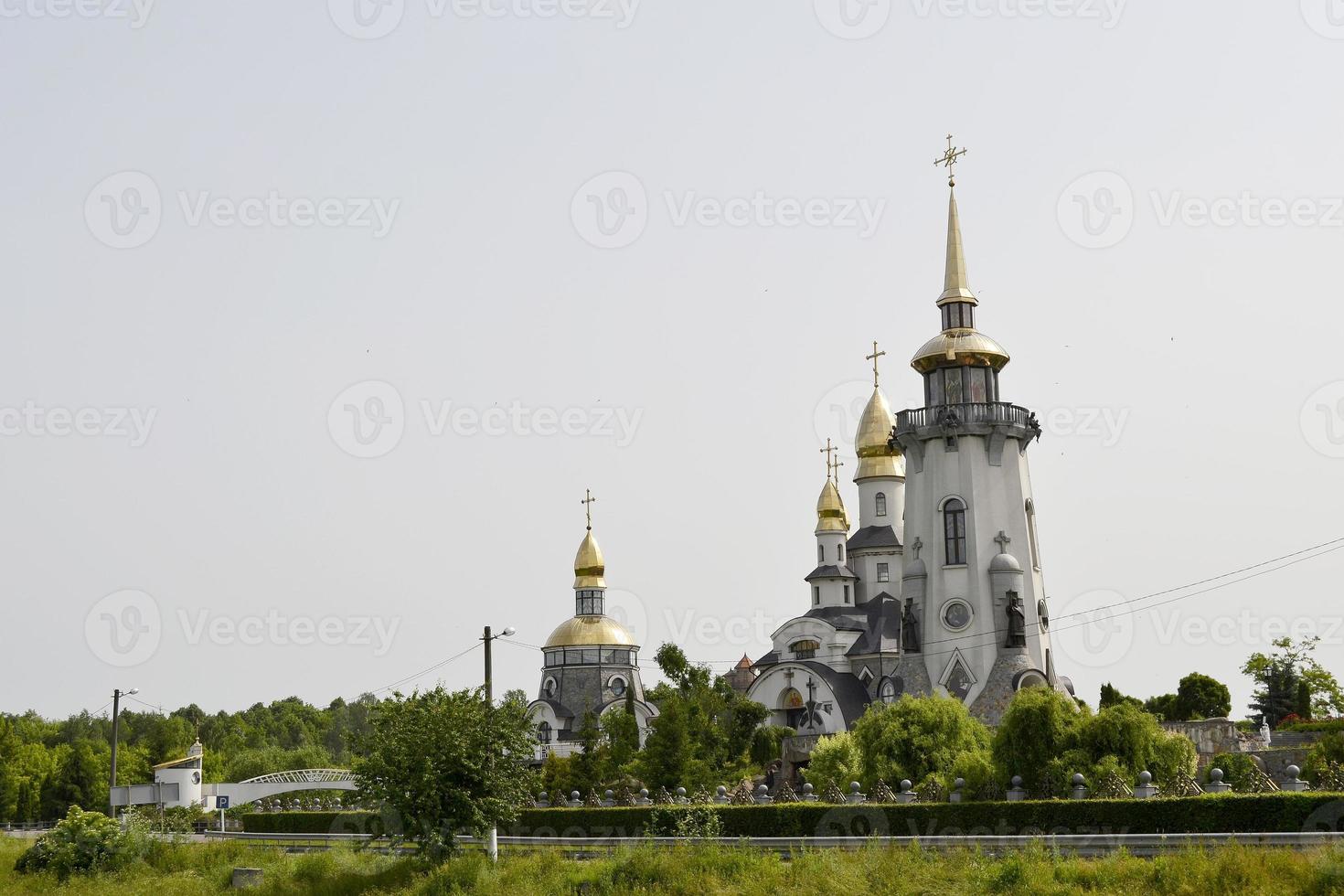 Christian church cross in high steeple tower for prayer photo