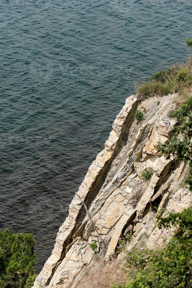 Rapid cliff above the sea photo