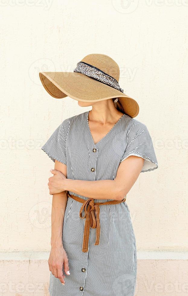 Portrait of a beautiful woman in elegant summer hat photo