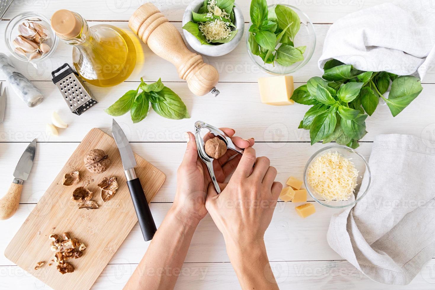 Step by step preparing italian pesto sauce. Step 5 - cracking nuts photo