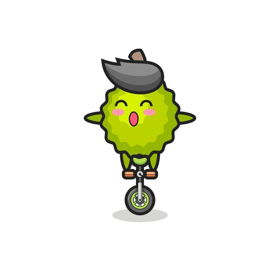 el lindo personaje de durian está montando una bicicleta de circo vector