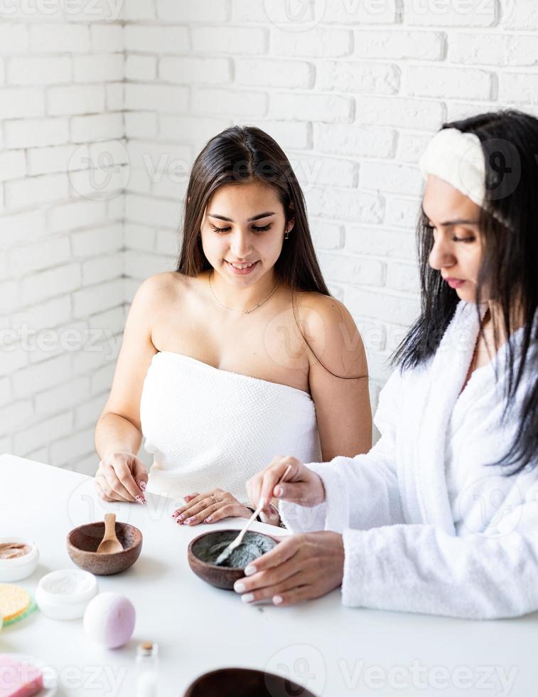 Women's hands making facial mask doing spa procedures photo