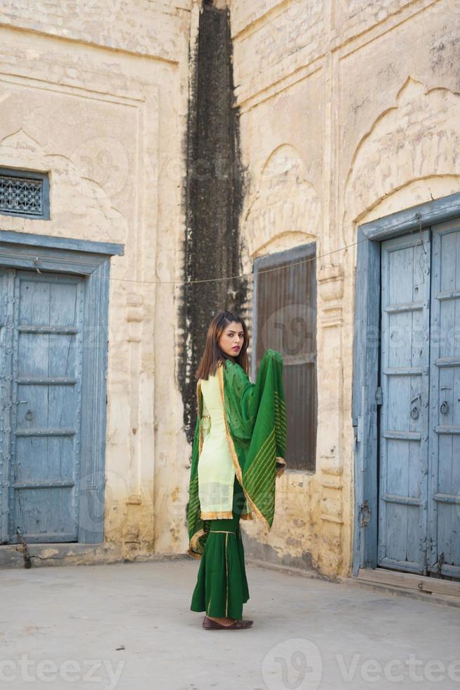 Girl in green suit photo