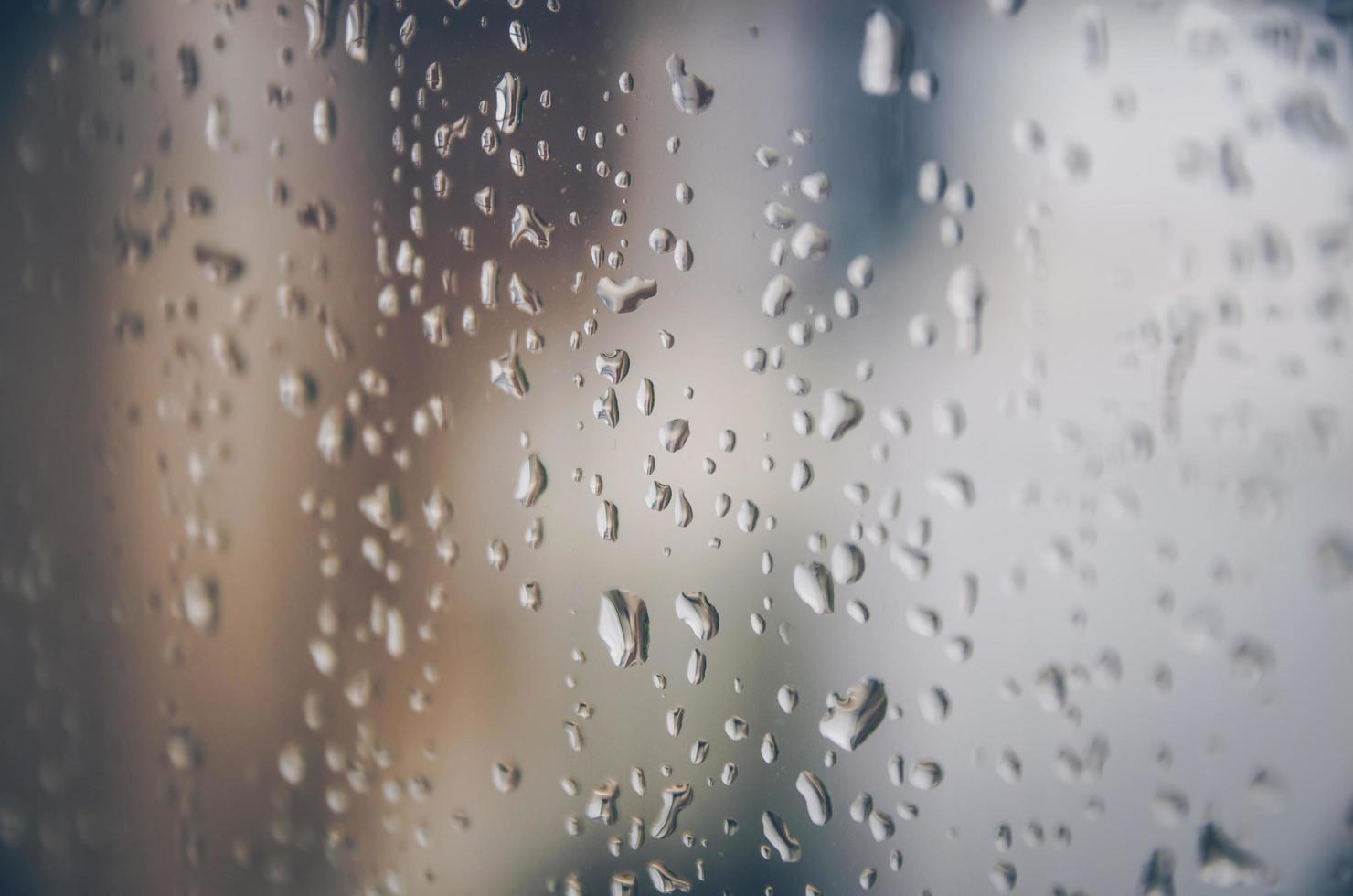 Background and wallpaper by rainy drop and water drops on window. photo