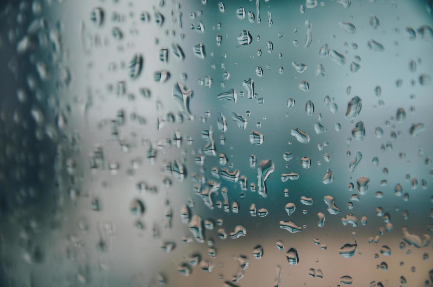 Background and wallpaper by rainy drop and water drops on window. photo