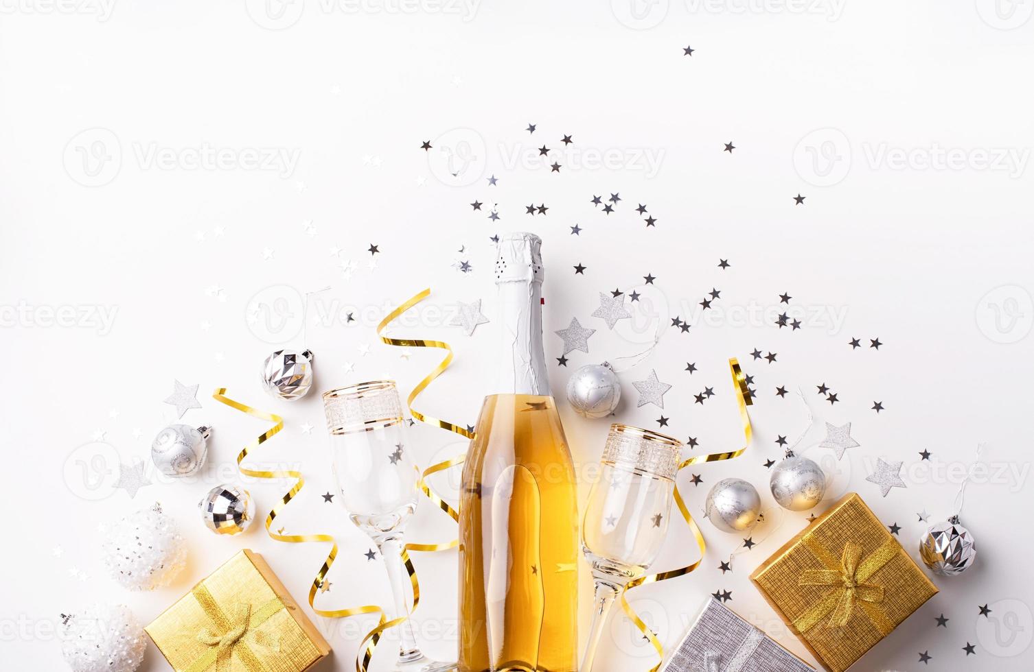 Christmas and New Year party decorations with confetti and gift photo