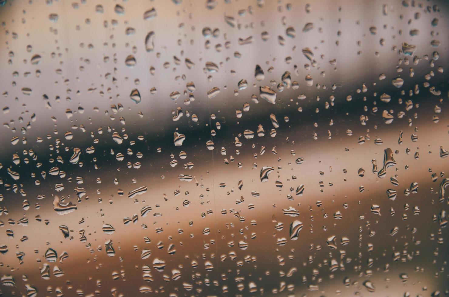 Background and wallpaper by rainy drop and water drops on window. photo