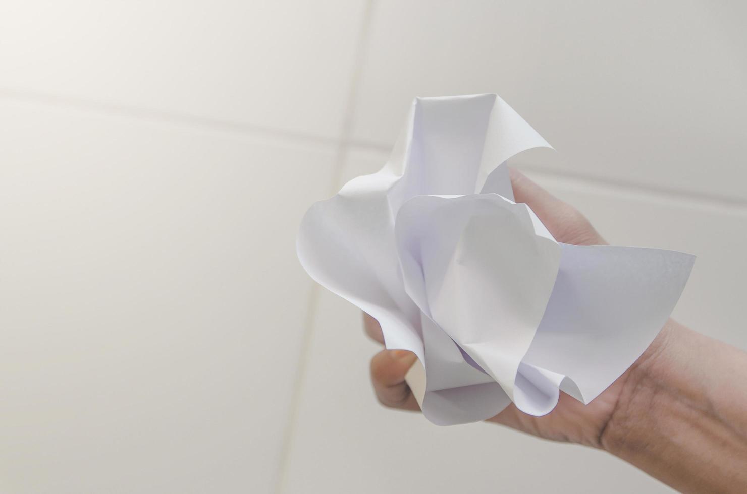 No idea and fail concept, Human hand holding crumpled paper and trash. photo
