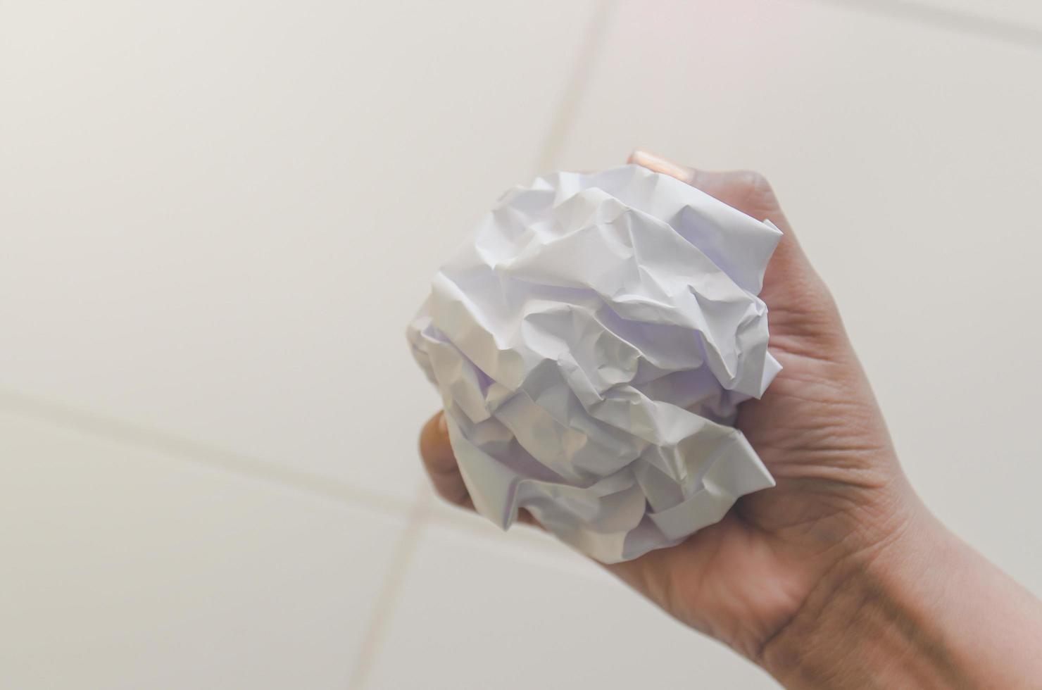 No idea and fail concept, Human hand holding crumpled paper and trash. photo