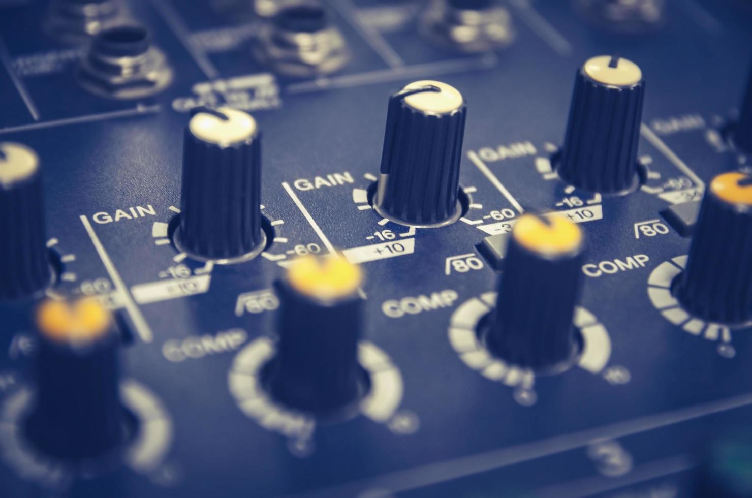 Audio mixer console and sound mixing with buttons and sliders. photo