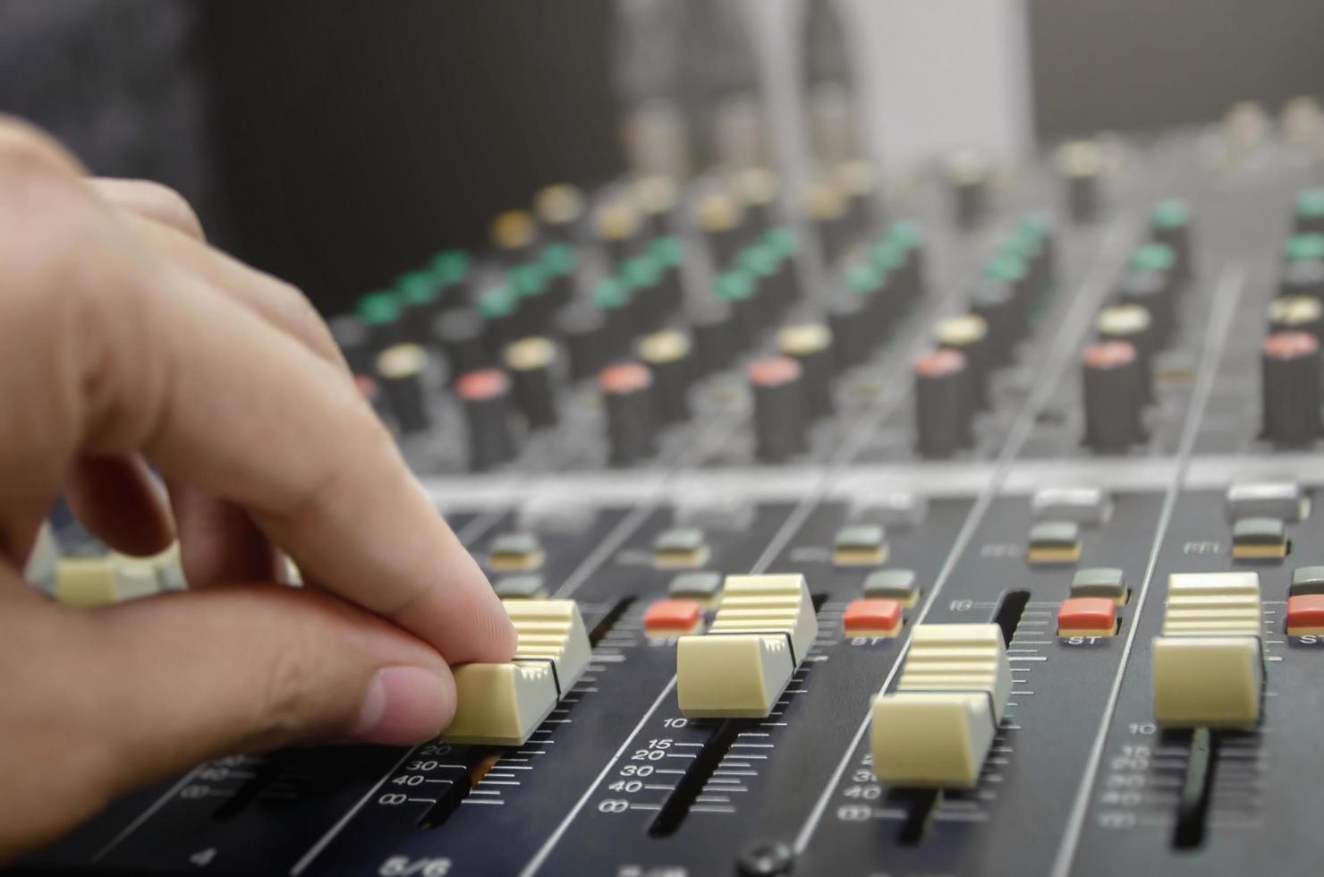 Audio mixer console and sound mixing with buttons and sliders. photo