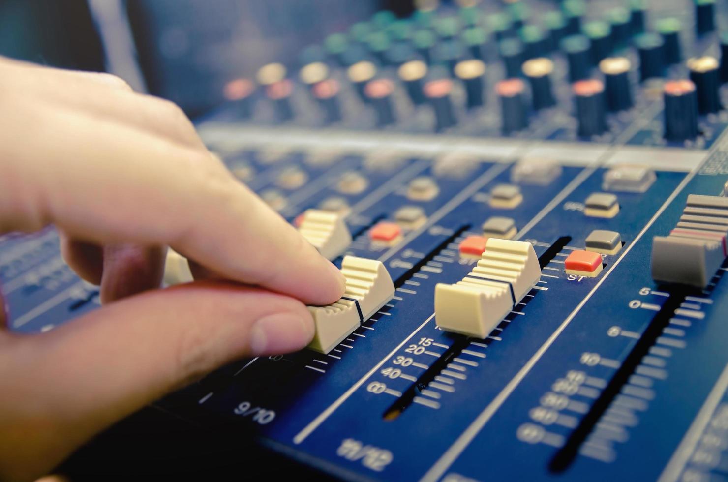 Audio mixer console and sound mixing with buttons and sliders. photo