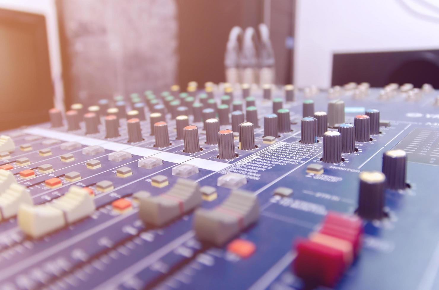 Audio mixer console and sound mixing with buttons and sliders. photo