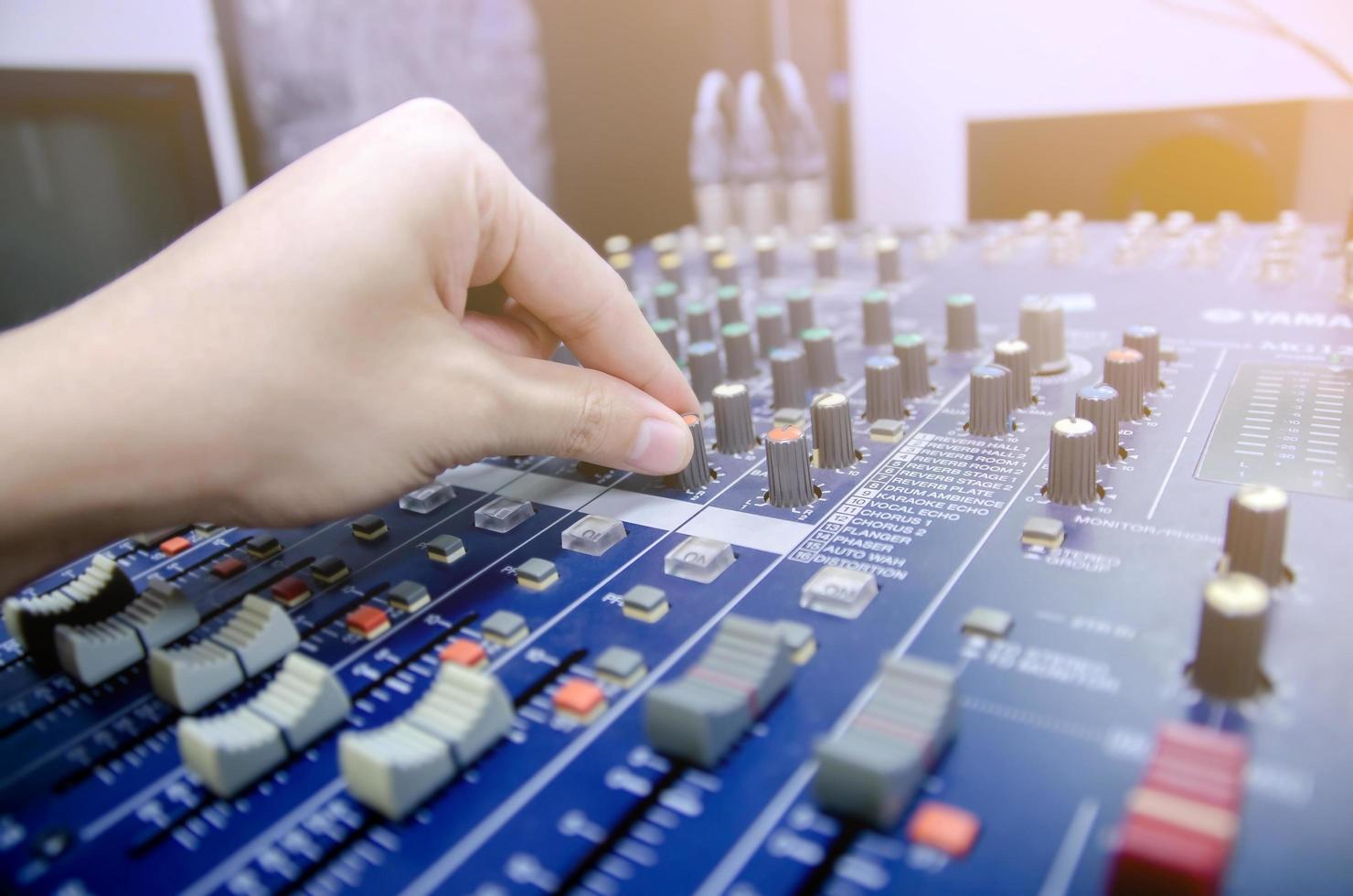 Audio mixer console and sound mixing with buttons and sliders. photo