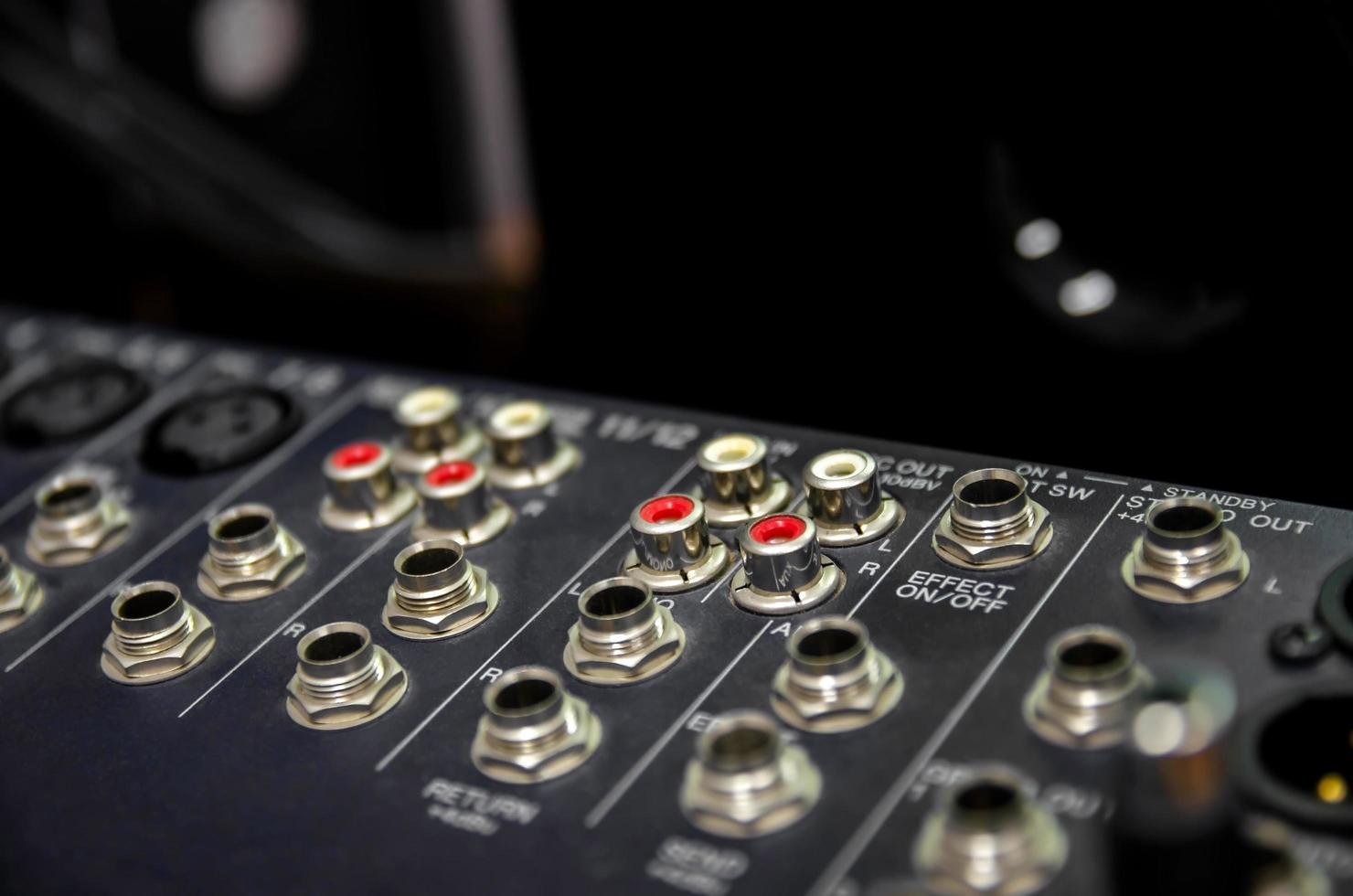 Audio mixer console and sound mixing with buttons and sliders. photo