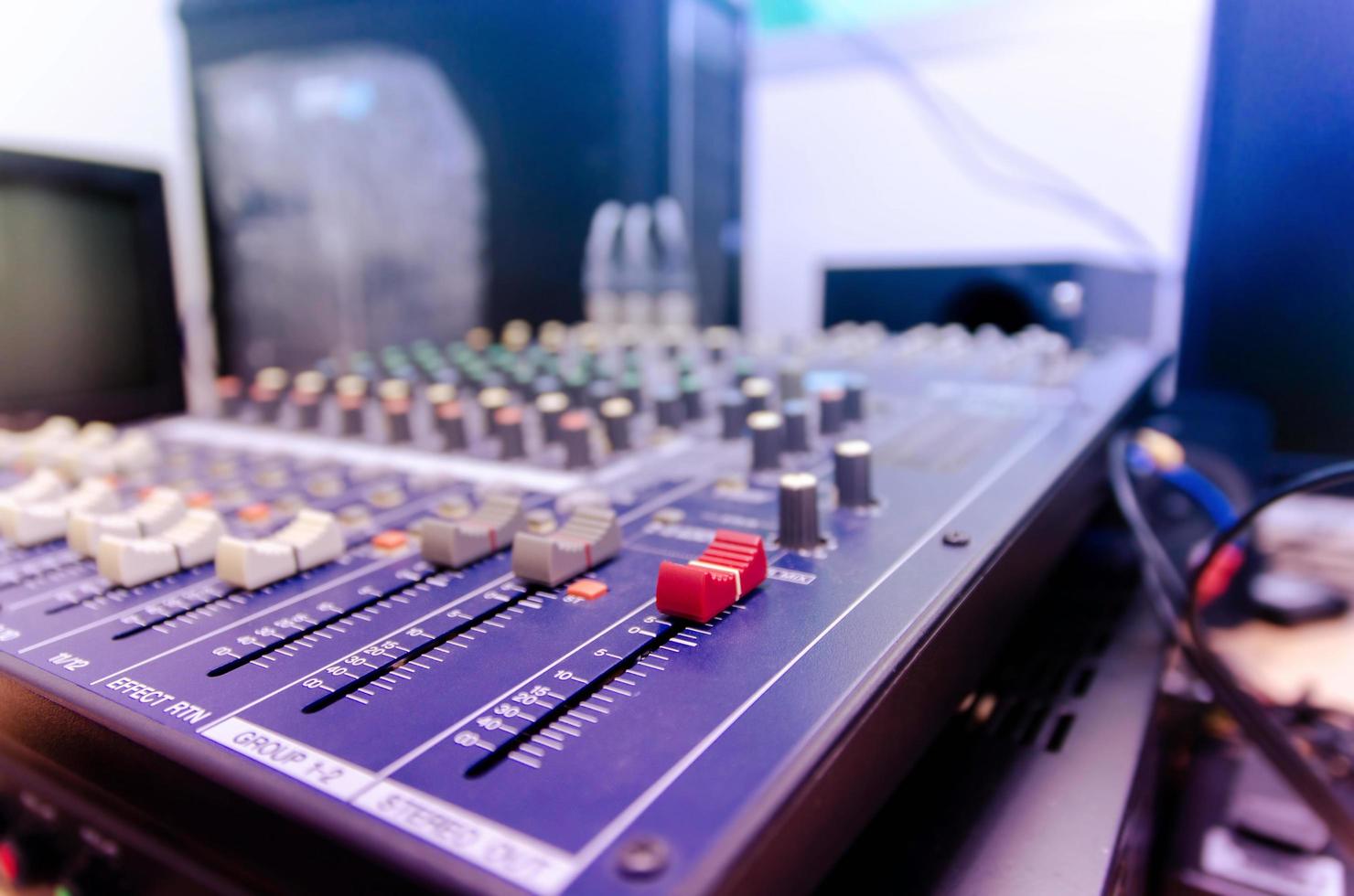 Audio mixer console and sound mixing with buttons and sliders. photo