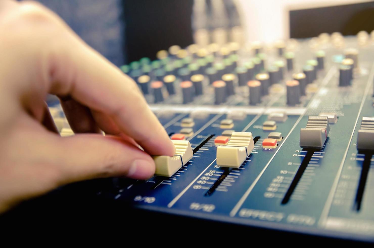 Audio mixer console and sound mixing with buttons and sliders. photo