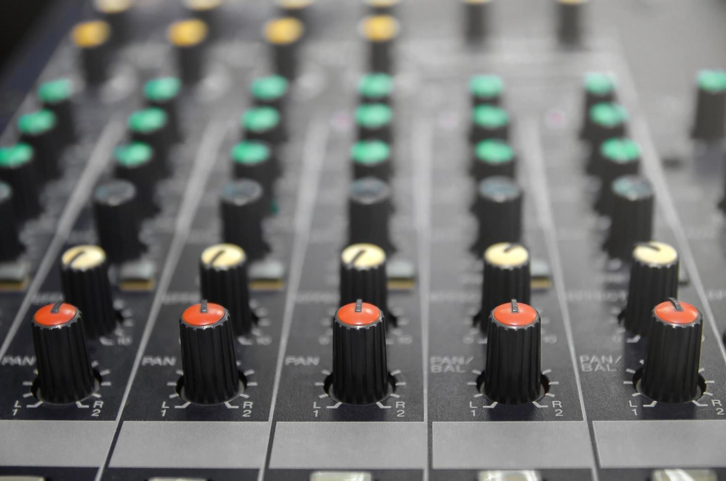 Audio mixer console and sound mixing with buttons and sliders. photo