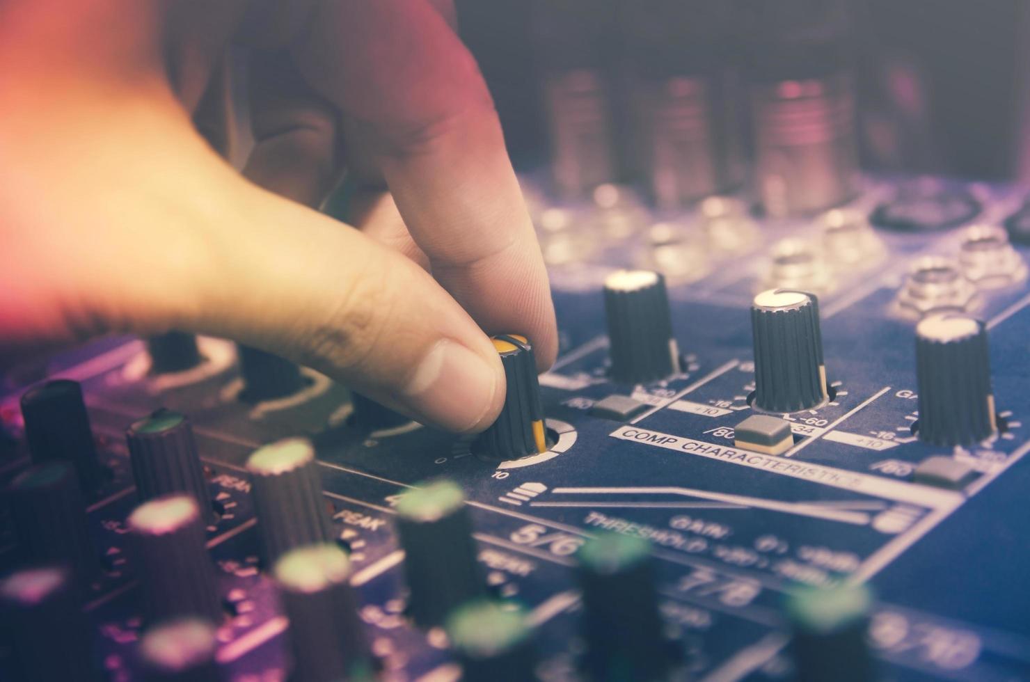 Audio mixer console and sound mixing with buttons and sliders. photo