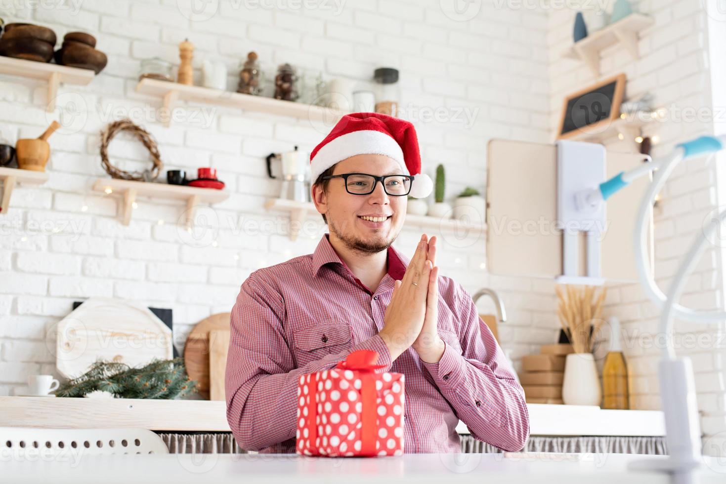 Man greeting his friends in video chat photo