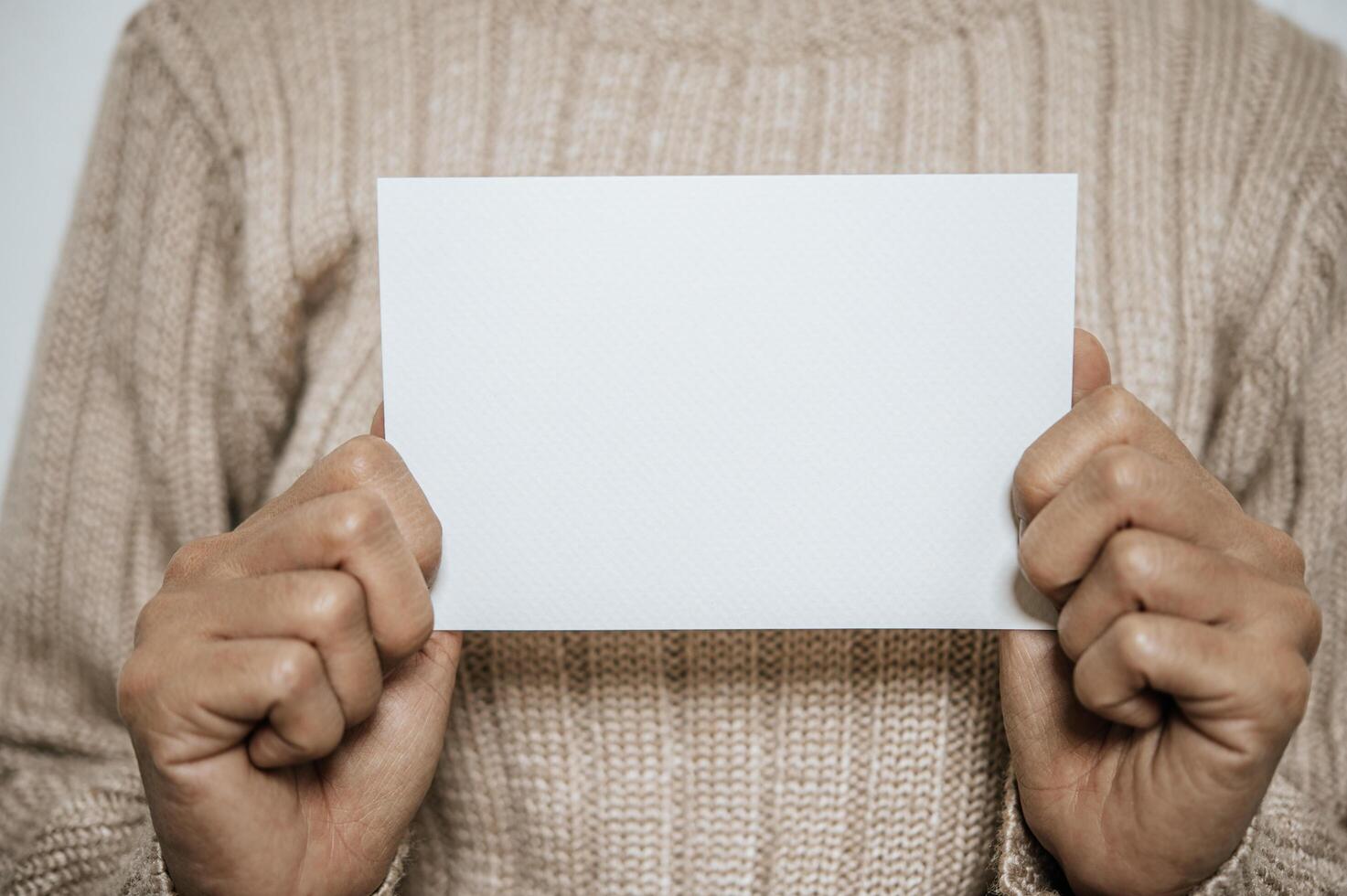Hands holding opened card or letter photo