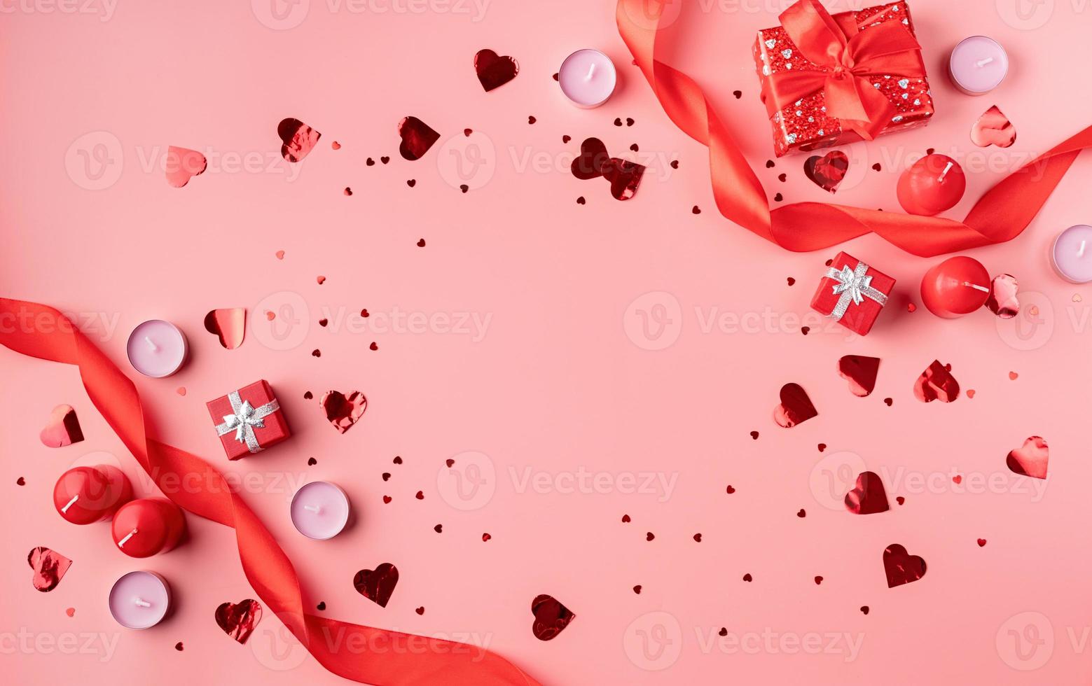 Valentines Day background with candles, gifts, hearts and confetti photo