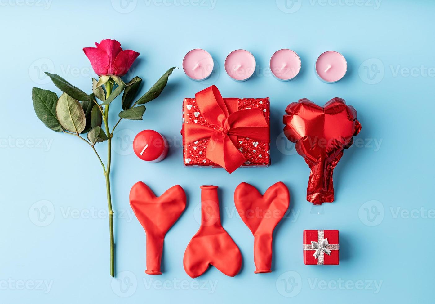 Valentines Day knolling objects decorated on blue background photo