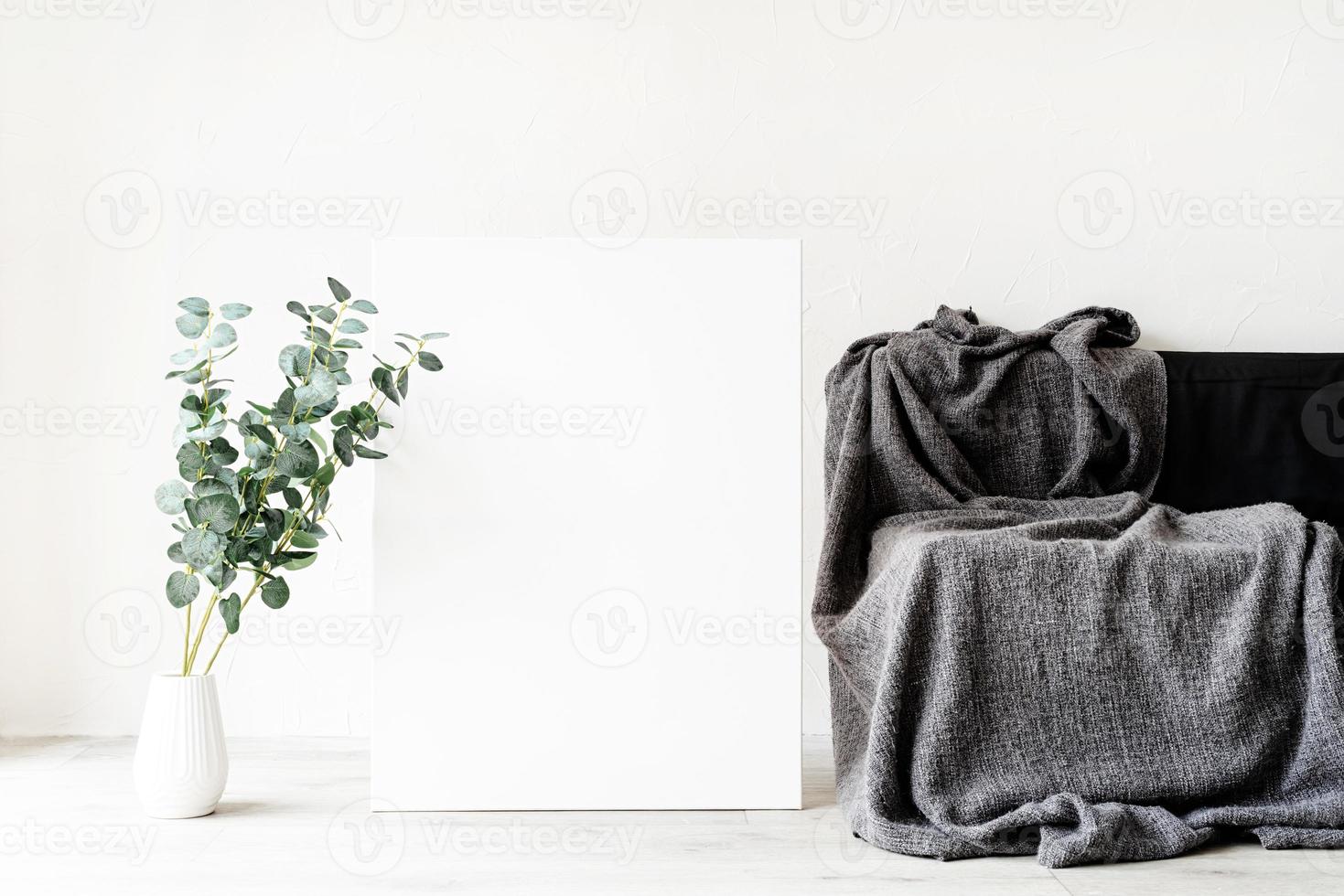 Mock up poster frame with decorations on white wall background photo