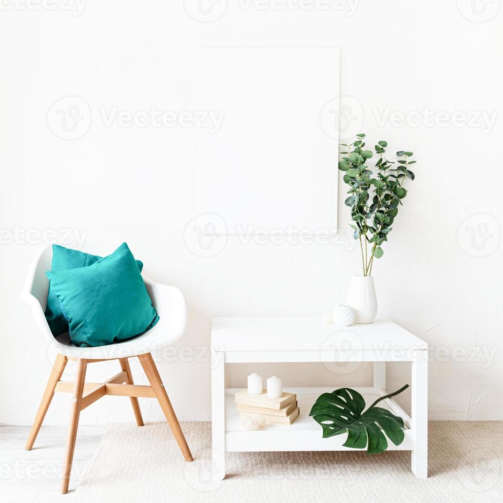 Mock up poster frame with decorations on white wall background photo