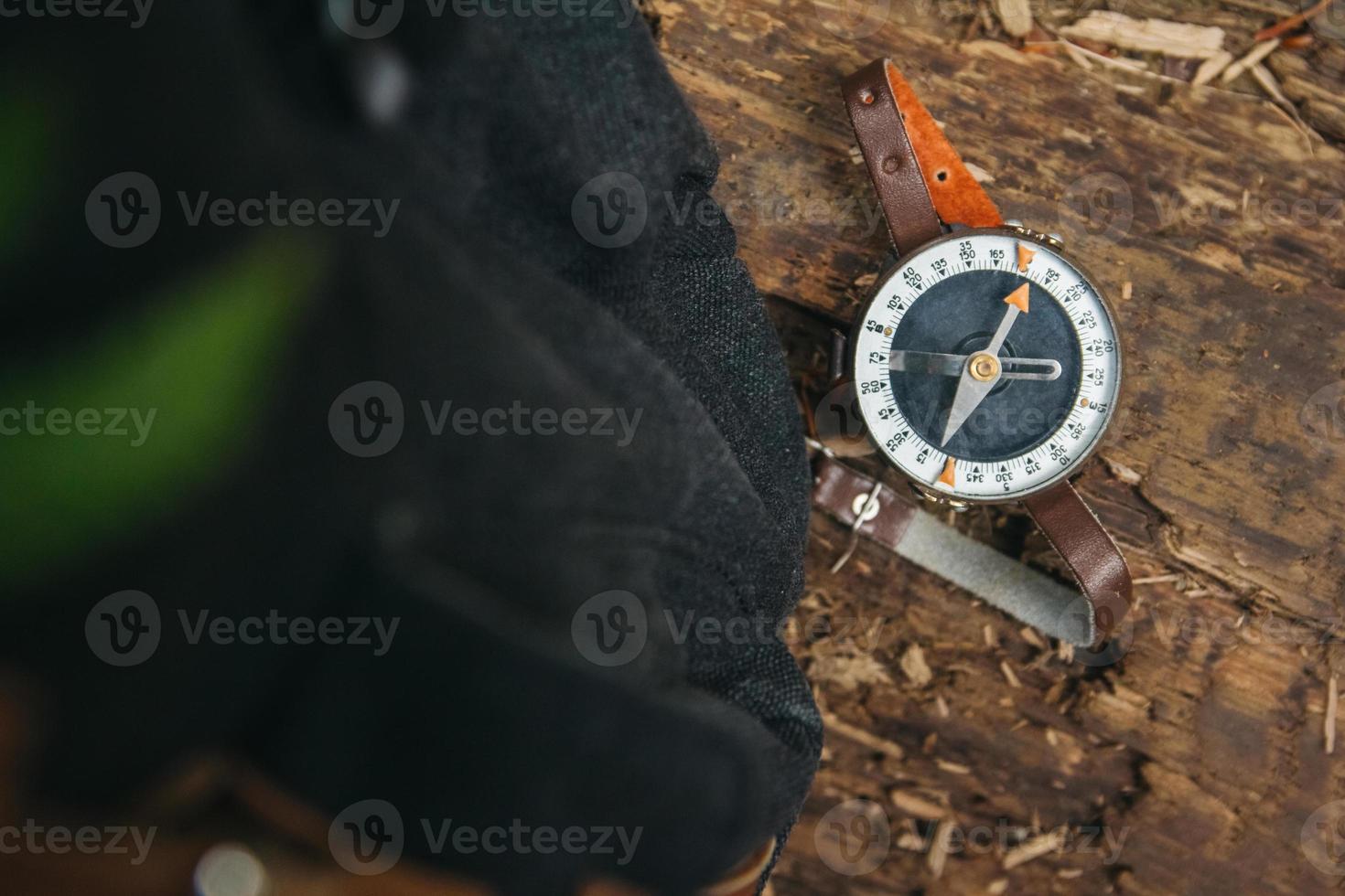 Compass on wooden background photo