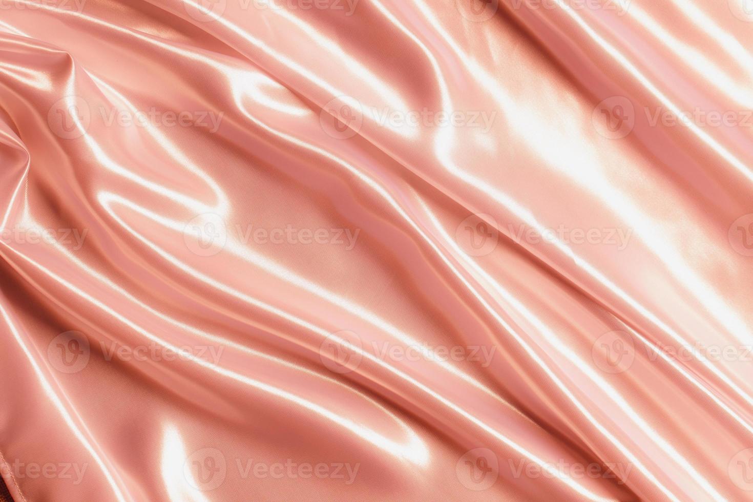 Abstract rose gold satin silky cloth for background photo