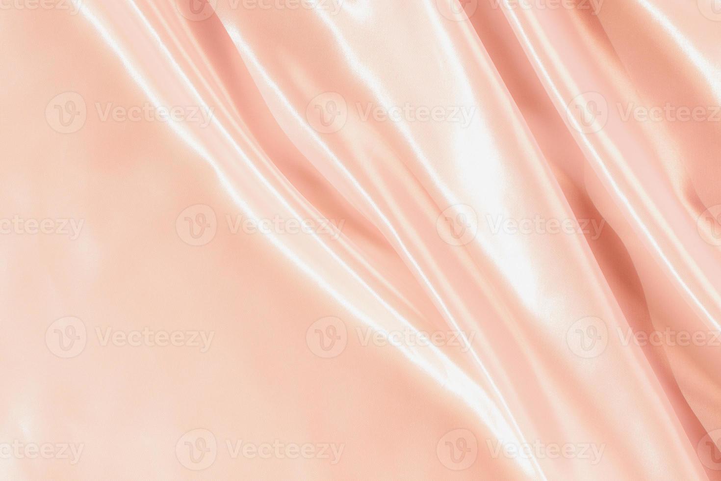 Paño sedoso satinado de oro rosa abstracto para el fondo foto