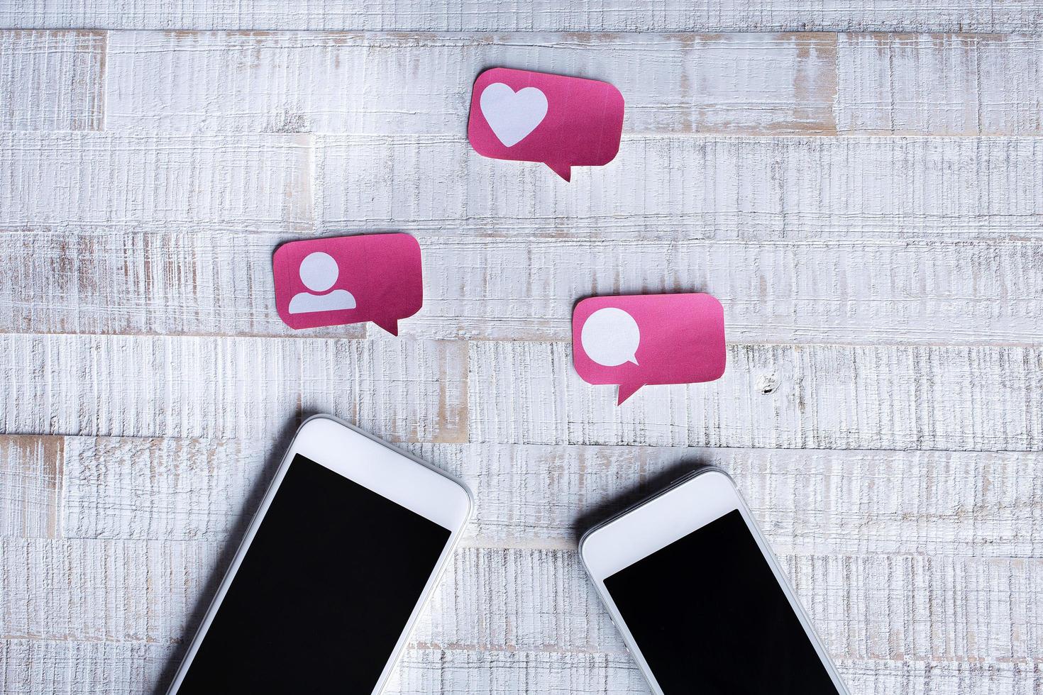 Paper Cut Social Media Icons with two Smartphones Content photo