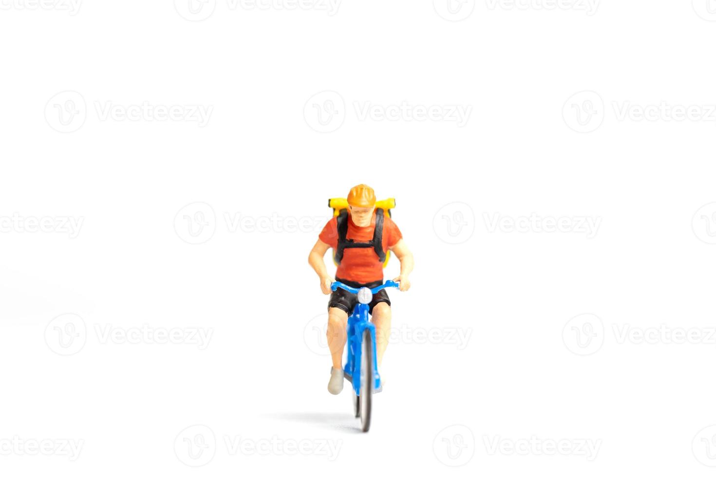 Miniature people Bicycle courier with parcel box on the back photo