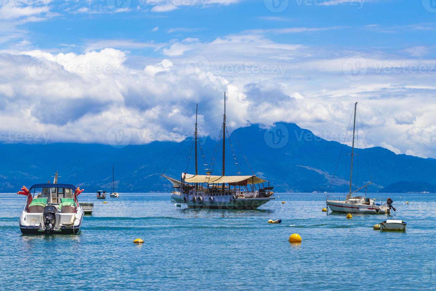 Boats ships and Boat trips Abraao beach Ilha Grande Brazil. photo