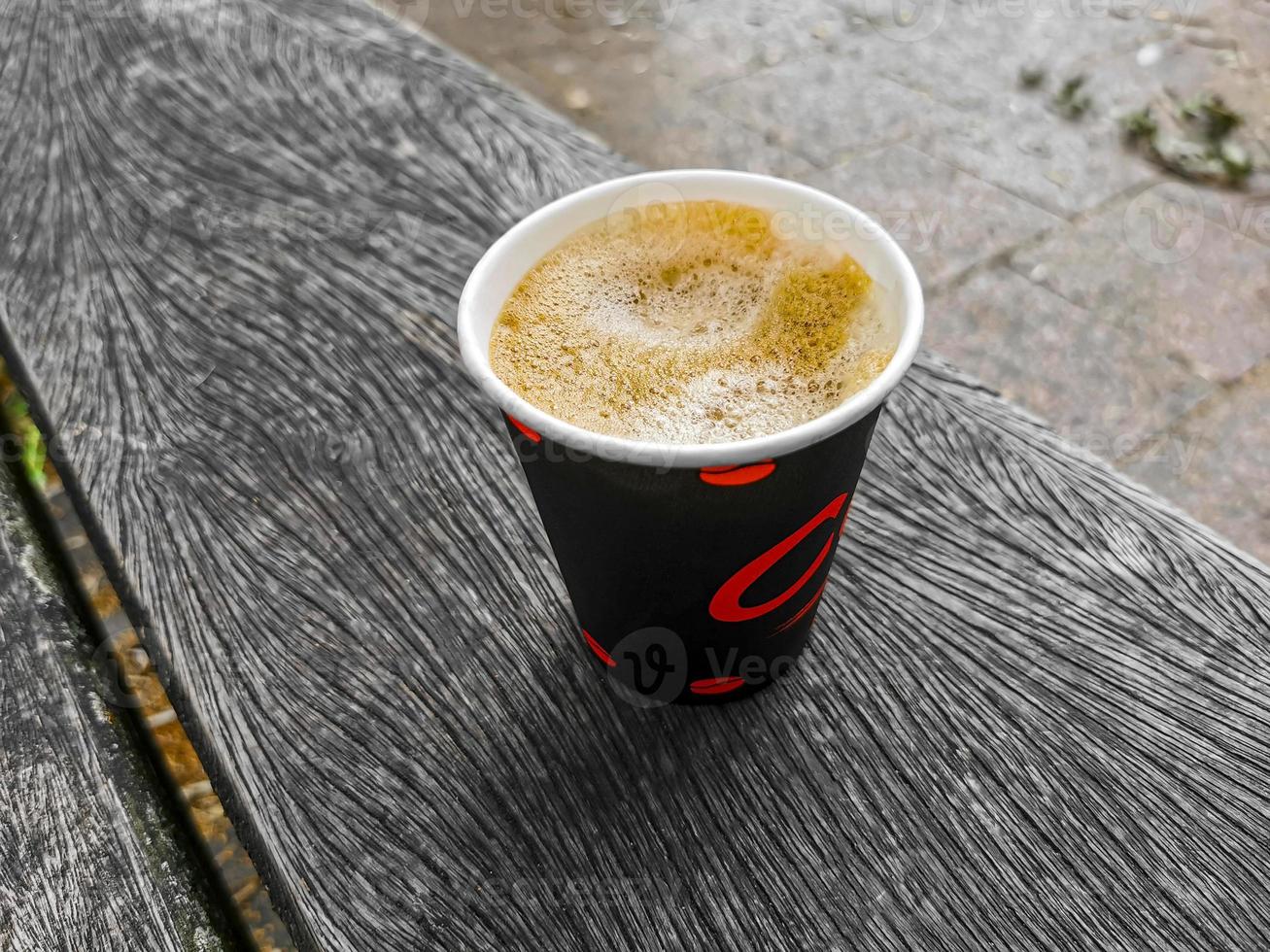 Red paper cup with coffee to go. Leherheide, Bremerhaven. photo