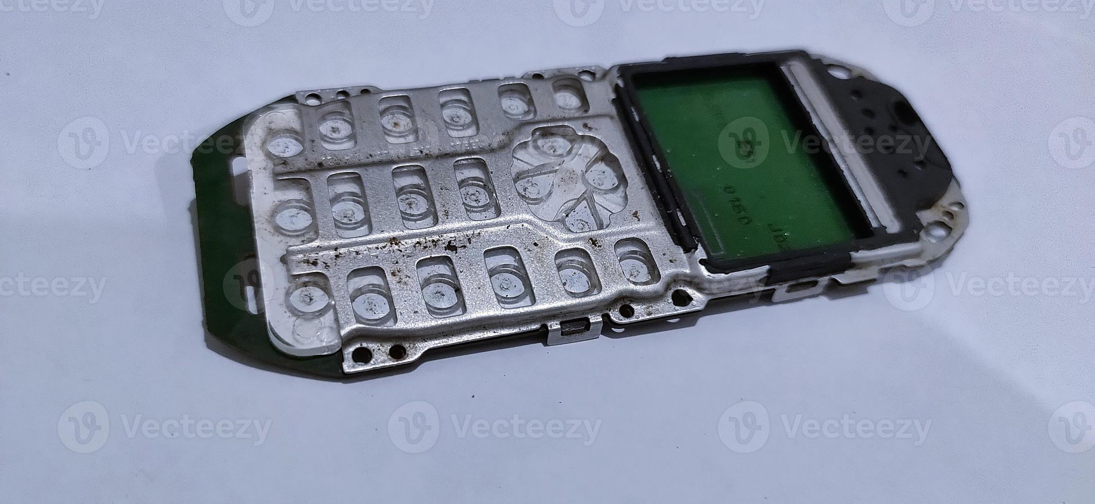 The damaged circuit board cellular is an older model photo