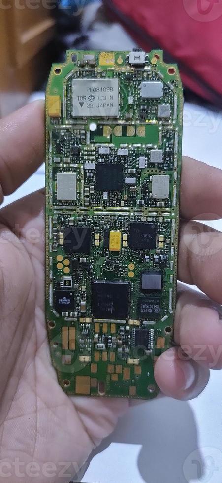 The damaged circuit board cellular is an older model photo