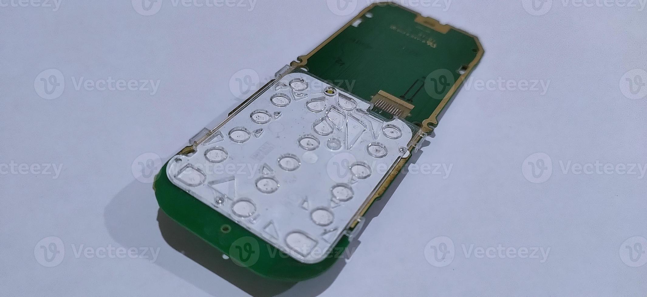 The damaged circuit board cellular is an older model photo