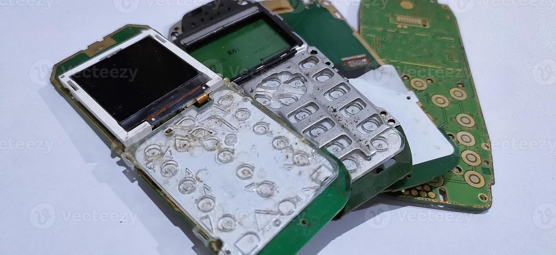 The damaged circuit board pile cellular is an older model photo
