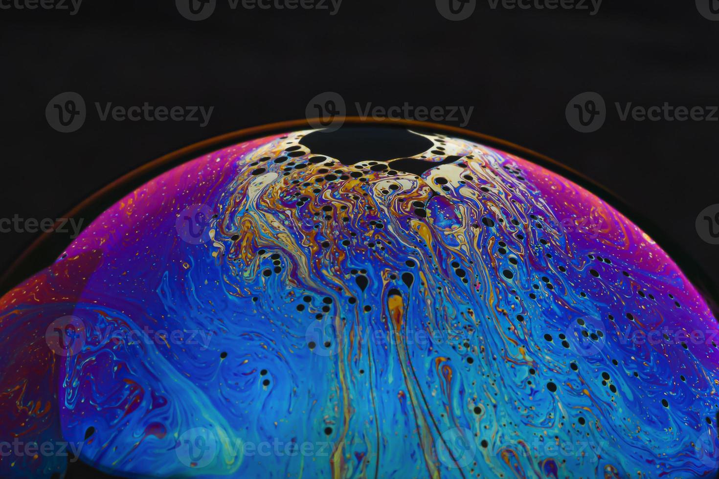 Beautiful psychedelic abstractions on the surface soap bubbles photo