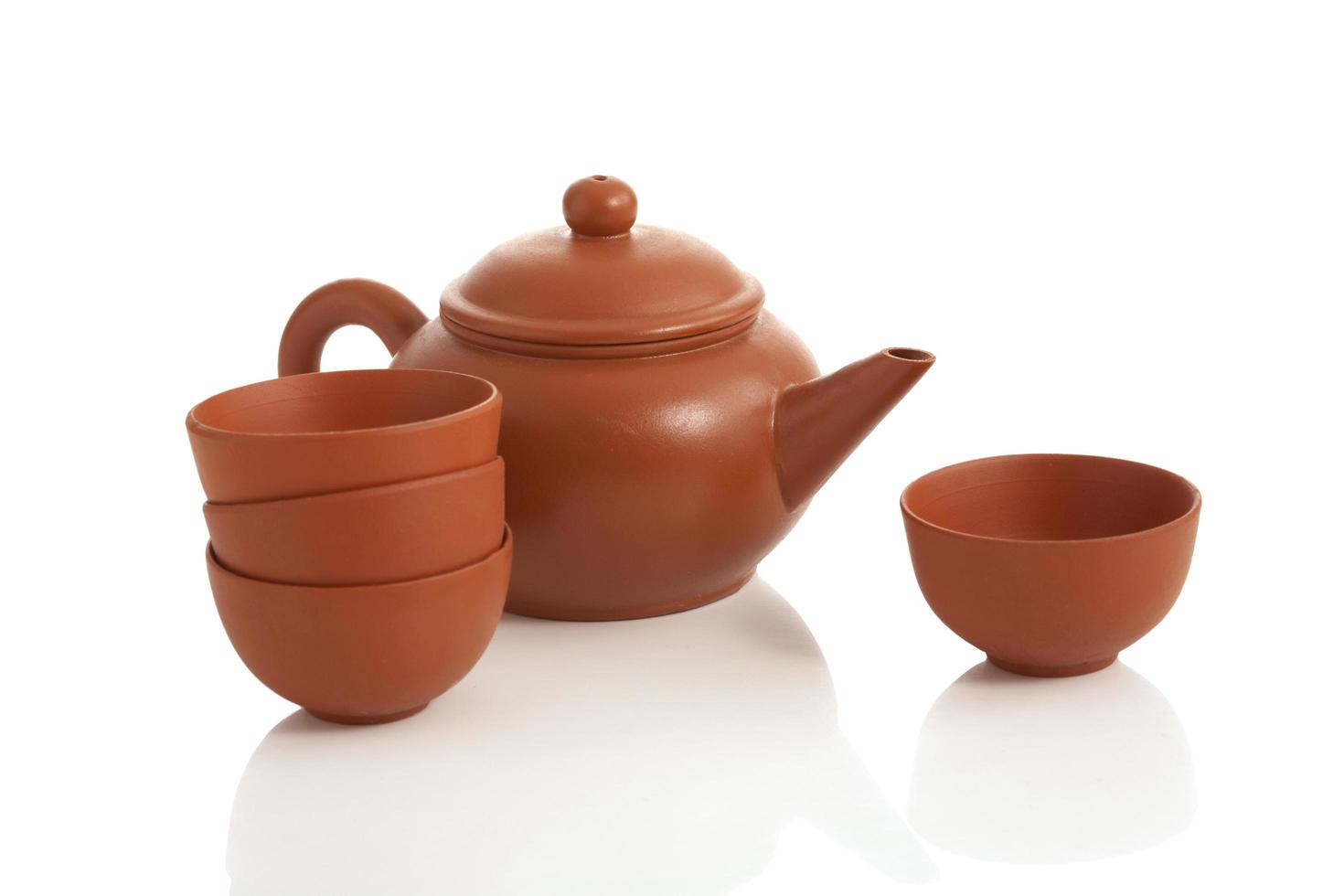 Vintage tea pot and cup on white background photo