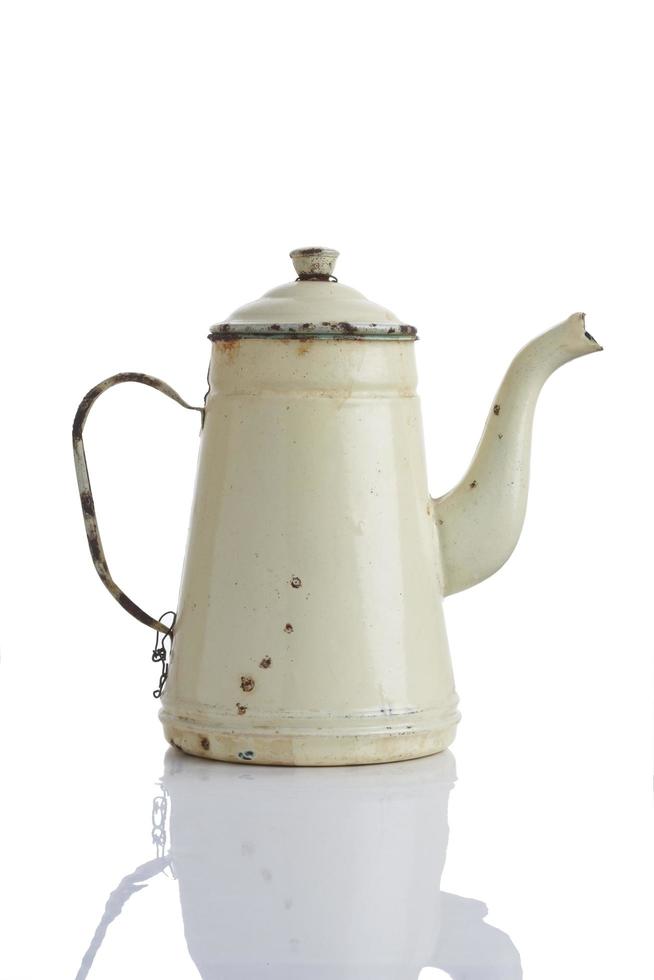 Yellow kettle on white background photo